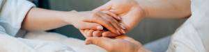 Doctor Holding Patients Hand